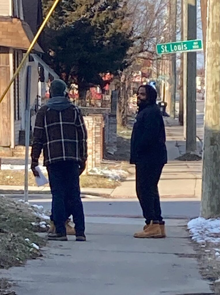 Two soul winners rejoicing after leading a person to Christ. Holding a King James Bible, they celebrate God's guidance in their soul-winning efforts and the joy of seeing a lost soul receive eternal life.