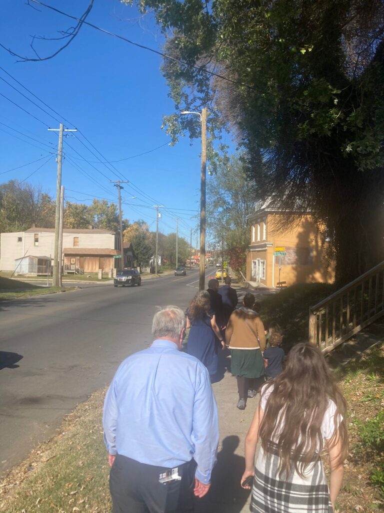 Church members knocking on doors to share the Gospel with residents. Church members going door-to-door sharing the Gospel.