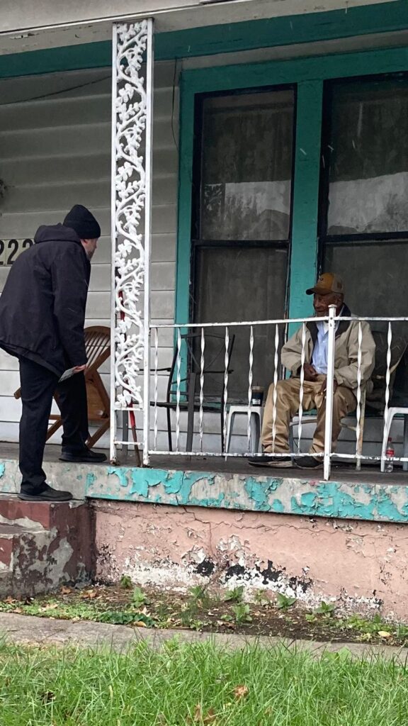 Volunteers from True Words Baptist Church distribute food and clothing to those in need.