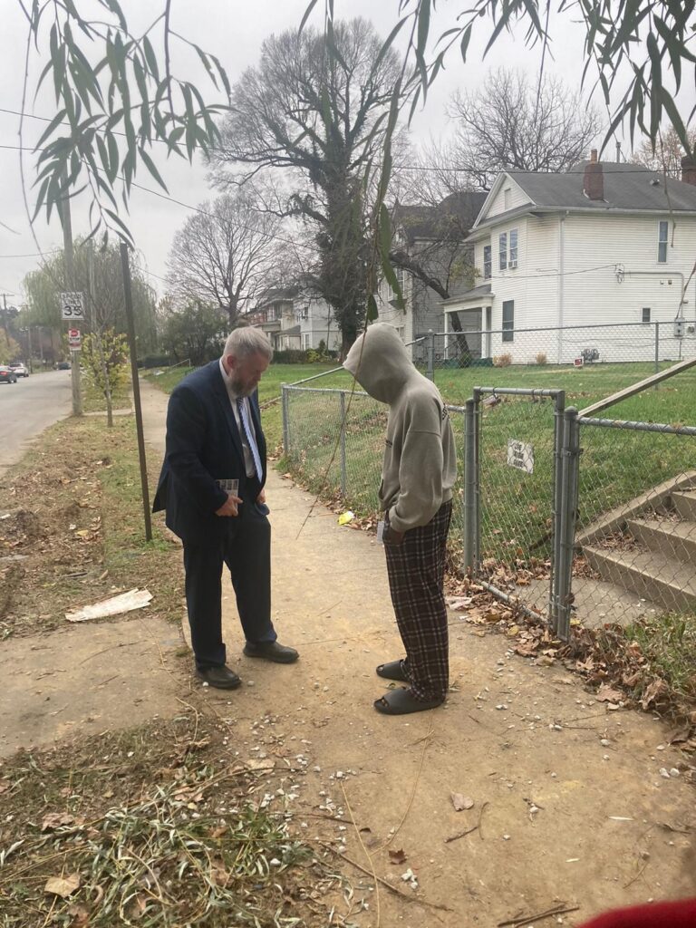 True Words Baptist Church members engaging in door-to-door evangelism in West Louisville, Kentucky.