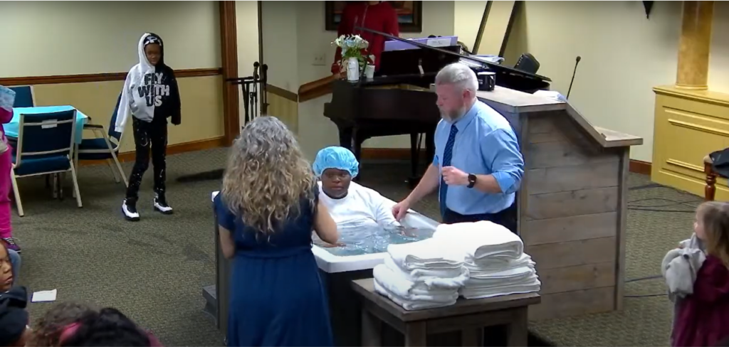 Brianna Byrd getting baptized in water at True Words Baptist Church showing her faith in the Lord Jesus Christ.