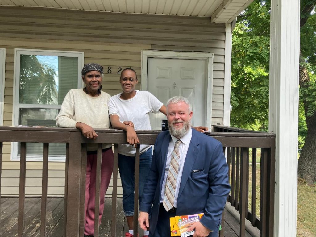 pastor joshua tapp taking a picture with a mother and daughter who believed on the Lord Jesus Christ