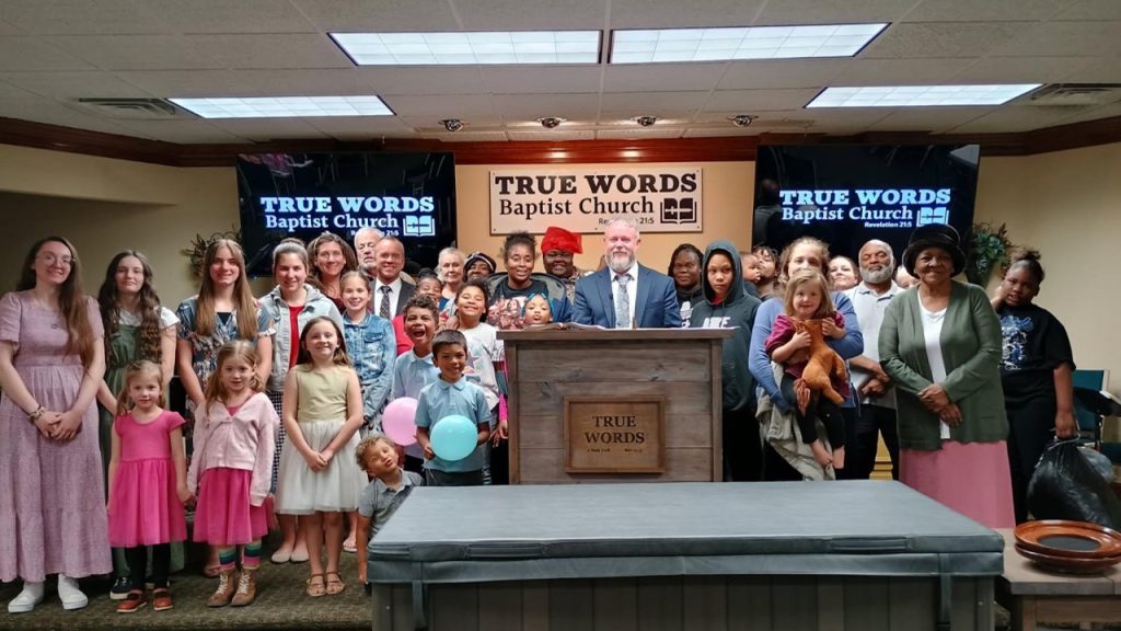 pastor joshua tapp of true words baptist church in louisville ky with the congregation on a special Thursday night service